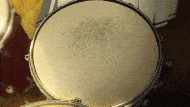 a close up of a drum with a few spots on it