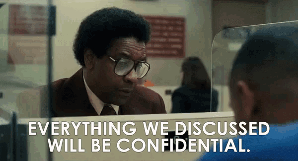a man with glasses looks at himself in a mirror with the words everything we discussed will be confidential below him