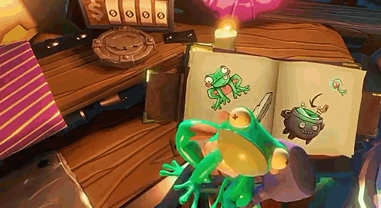 a frog is sitting in front of an open book with a picture of a frog on it