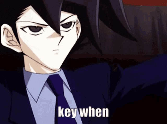 a man in a suit and tie is saying key when in a cartoon .
