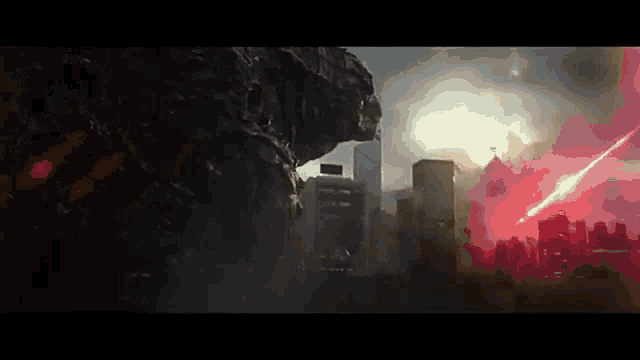 a giant monster is standing in the middle of a city with a red light coming out of its mouth .