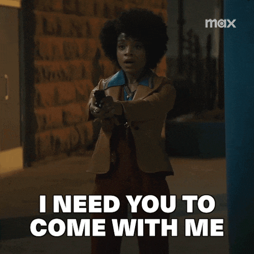 a woman is holding a gun and saying i need you to come with me