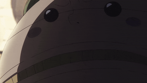 a close up of a cartoon character 's mouth with a black eye