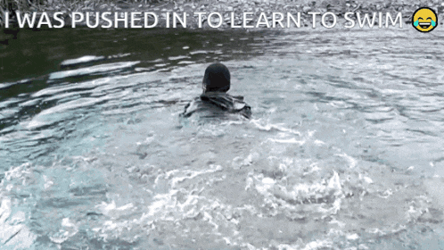 a picture of a person in the water with the words i was pushed in to learn to swim