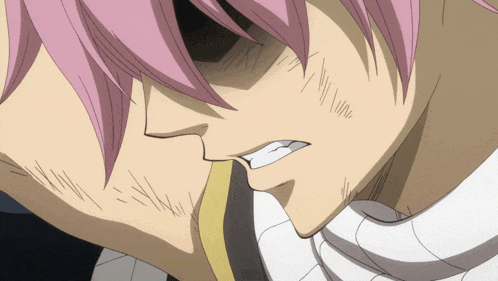a close up of a man with pink hair and a beard