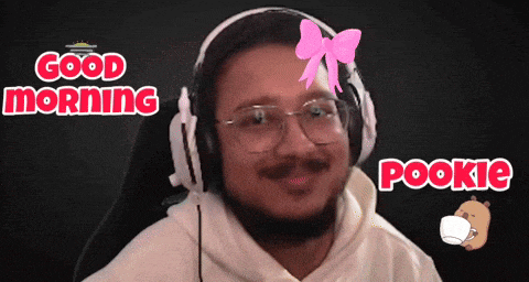 a man wearing headphones has a pink bow on his head and the words good morning pookie below him