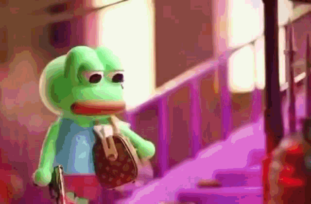 a green frog holding a louis vuitton purse