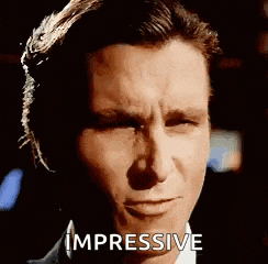 a close up of a man 's face with the word impressive on it .