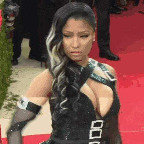 a woman wearing a black dress with a plunging neckline and a belt that says 000