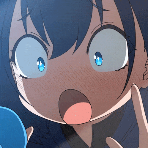 a close up of a girl 's face with blue eyes