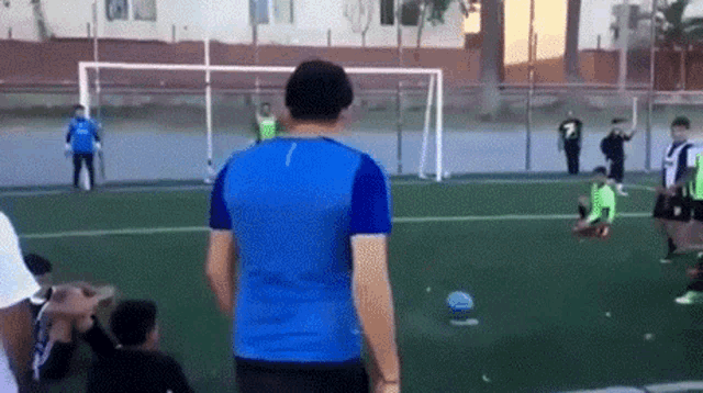a man in a blue shirt with the number 7 on it