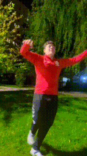 a person wearing a red shirt that says the north face