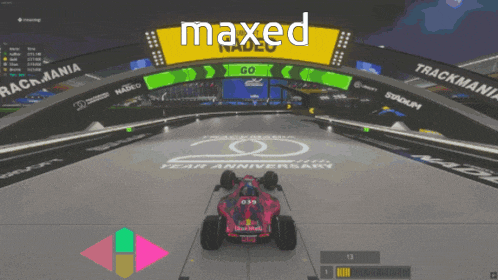 a red bull race car is driving on a track in a video game called maxed