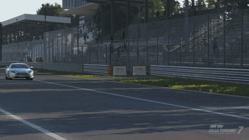 a blurred image of a car that says gran turismo 7 on the bottom right