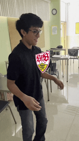 a young man in a black shirt with a shield that says svs