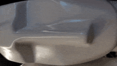 a close up of a white object that looks like a car
