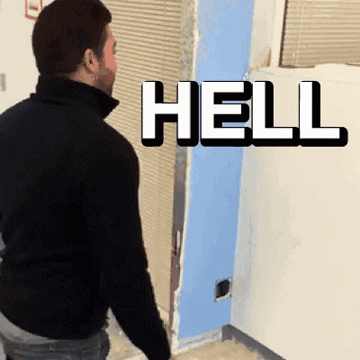 a man standing in front of a wall with the word hell above him