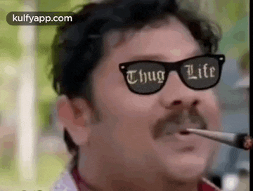 a man with a mustache and sunglasses is smoking a cigarette .