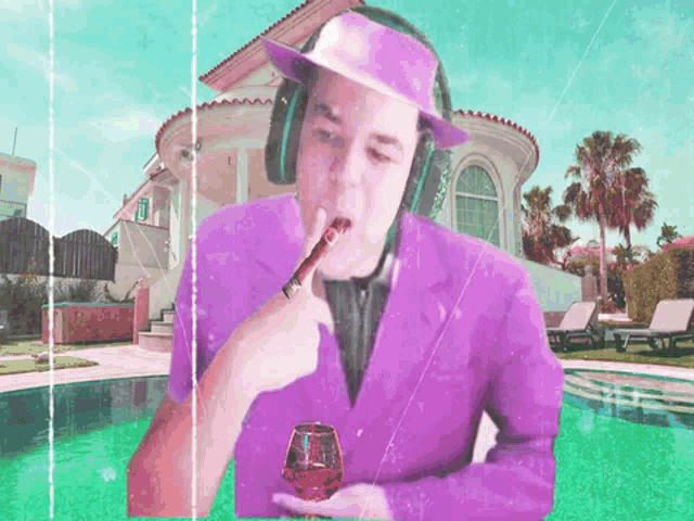 a man in a purple suit is smoking a cigar and drinking wine