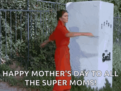 a woman in a red dress is standing in front of a white box that says exit
