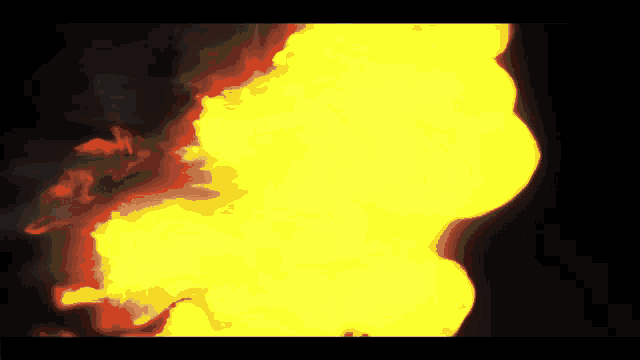 a close up of a fire with a dark background