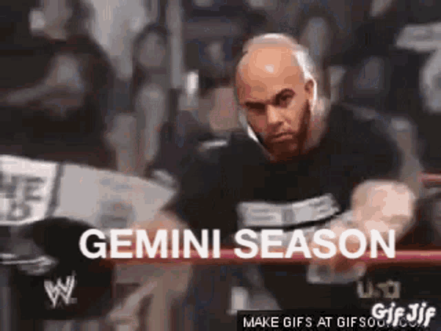 a bald man is standing in a boxing ring with the words `` gemini season '' written on the bottom .