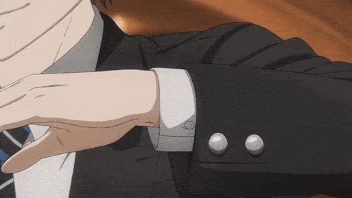a close up of a man 's sleeve with buttons