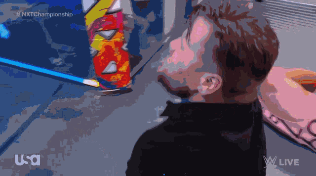 a drawing of a man with a can of soda in front of him that says nxt championship on it