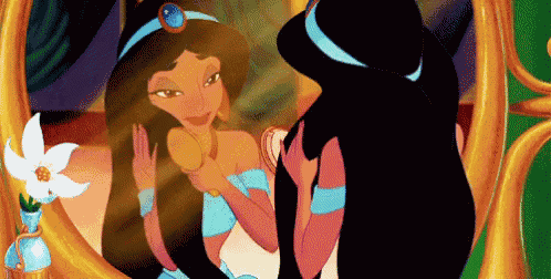 jasmine from disney looks at herself in the mirror