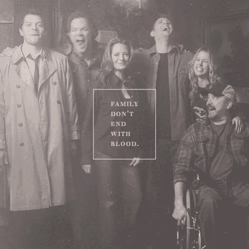 a black and white photo of a family with the words family don 't end with blood