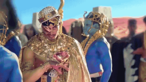 a man dressed as a pharaoh is standing in a crowd