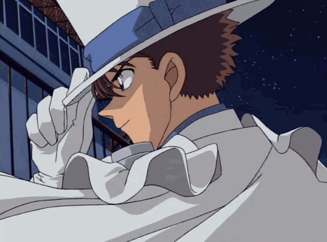 a man wearing a blue and white top hat and a white cape