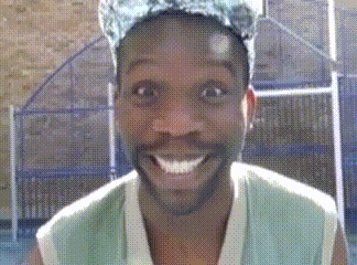 a man with a beard and a hat is smiling