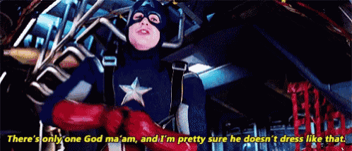 a man in a captain america costume is talking to another man in a superhero costume .