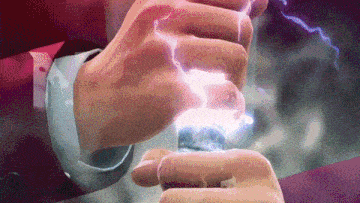 a man in a suit is holding a lightning bolt in his hand .