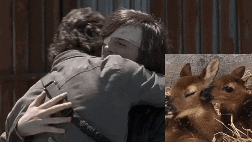 a man hugging another man next to a picture of a deer