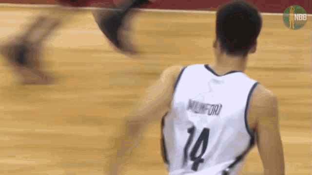 a basketball player with the number 14 on the back of his shirt