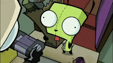 a cartoon character with a tongue sticking out is standing next to a machine