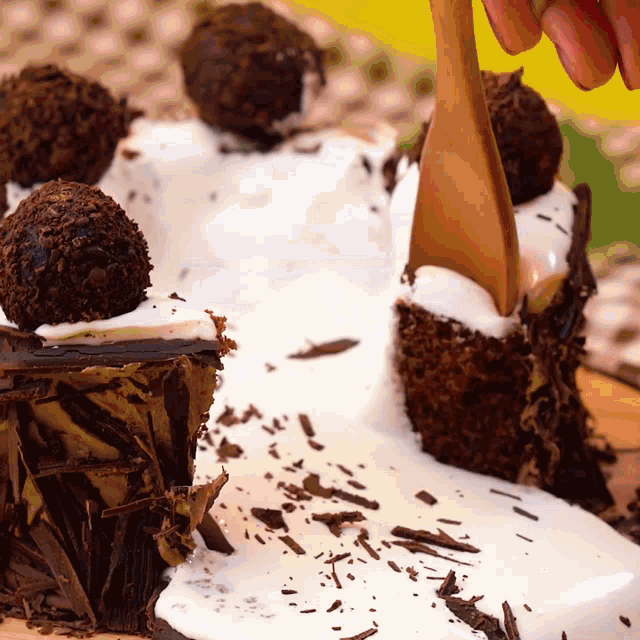 a close up of a chocolate cake with white frosting