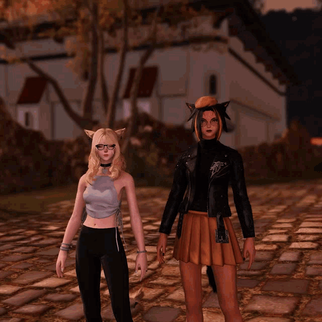 two women are standing next to each other on a cobblestone street