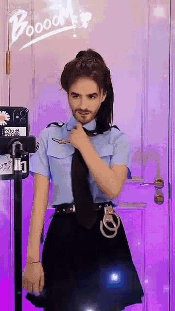 a man in a police uniform is standing in front of a purple door