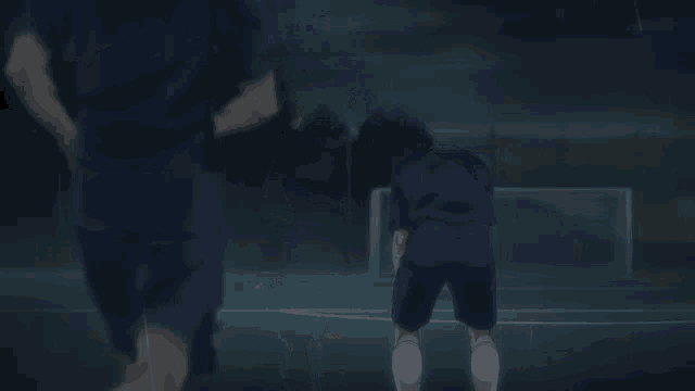 two soccer players one with the number 3 on his shorts