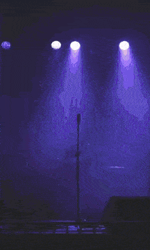 a purple sign that says we is lit up