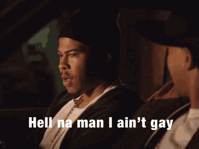 a man sitting in a car with the words hell na man i ain 't gay below him