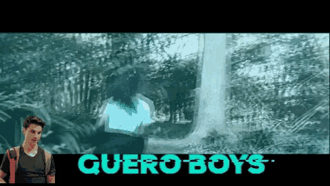 a man stands in front of a screen that says queroboys