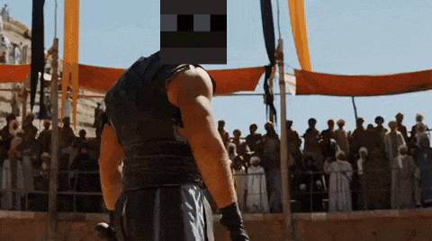 a man stands in front of a crowd with a pixelated face covering his face