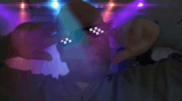 a pixelated image of a person wearing glasses with a checkered pattern on them