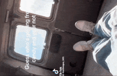 a person 's feet are shown in front of a window with the caption guess who 's getting free candy