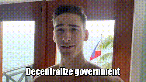 a shirtless man is standing in front of a window with the words " decentralize government " written below him