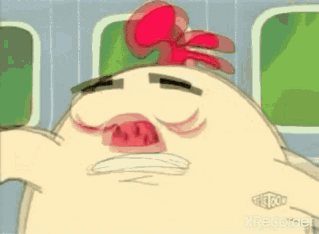 a close up of a cartoon character 's face with a red bow on his head .
